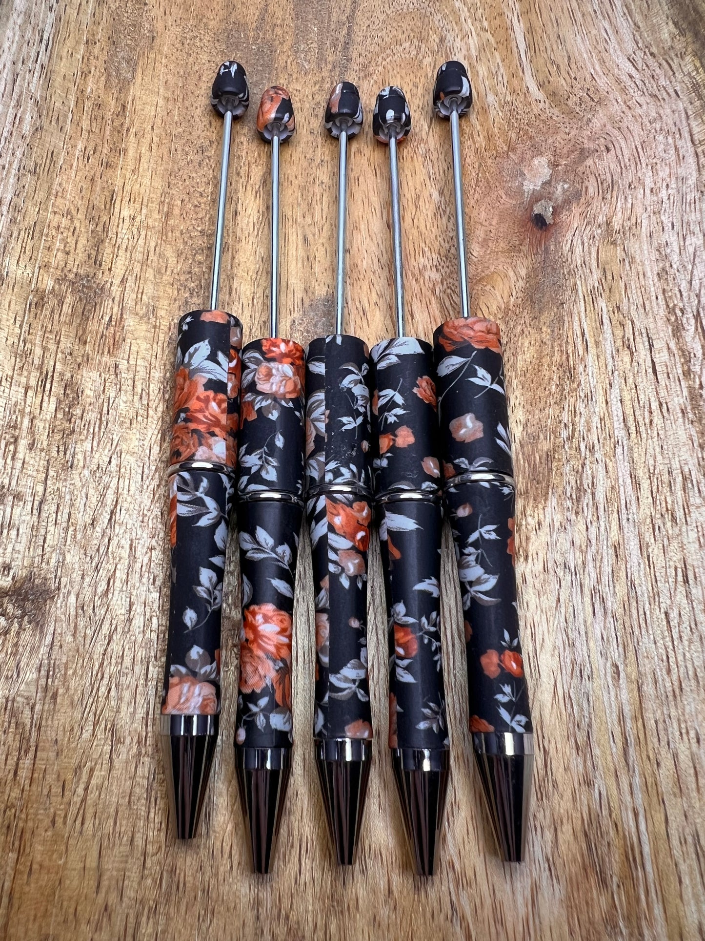 Orange & black floral printed pens (sold individually)