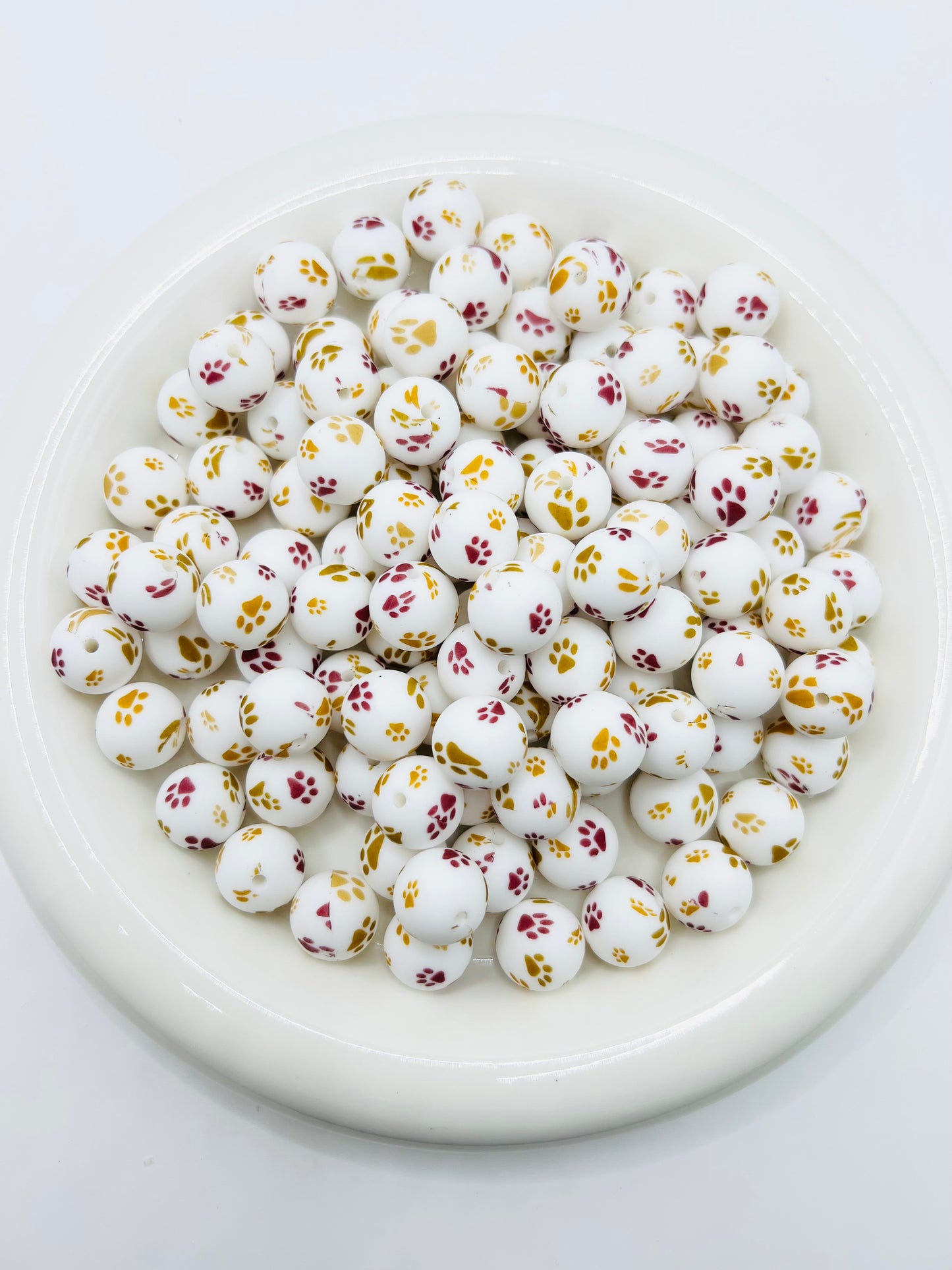 15mm golden burgundy paw print silicone beads